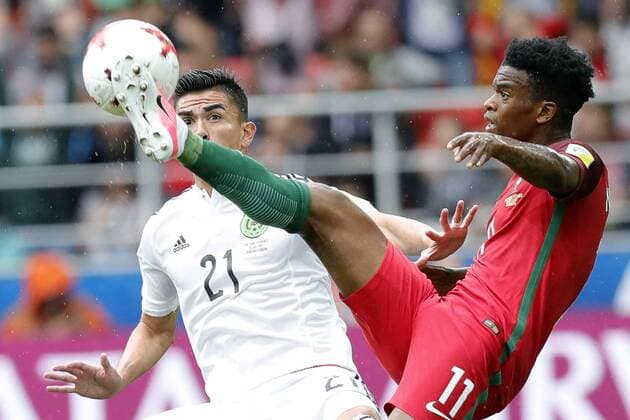 MOSCOW, RUSSIA â€“ JULY 2, 2017: Mexicoâ€™s Luis Reyes (L) and Portugalâ€™s Nelson Semedo struggle for the ball in their 2017 FIFA Confederations Cup third place football match at Otkrytie Arena. Mikhail Japaridze TASS  TS055C55