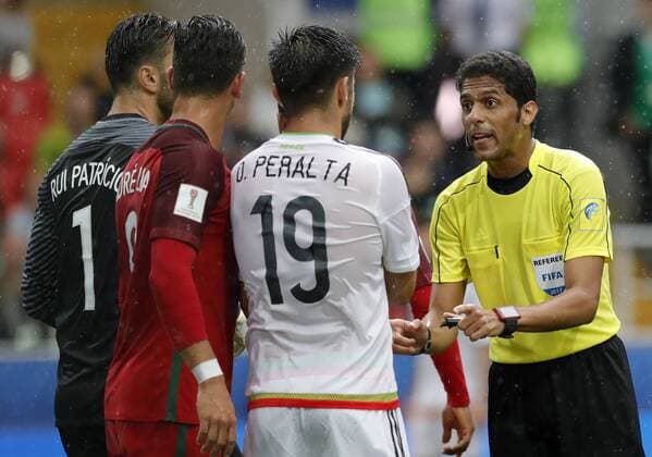 MOSCOW, RUSSIA â€“ JULY 2, 2017: Chief referee Fahad Al-Mirdasi (R) in the 2017 FIFA Confederations Cup third place football match between Portugal and Mexico at Otkrytie Arena. Mikhail Japaridze TASS  TS055C65
