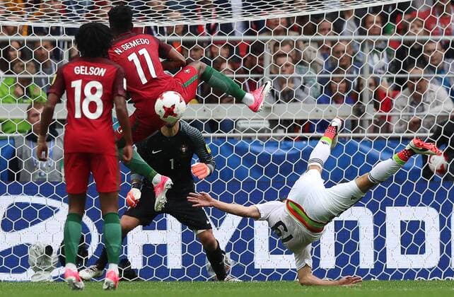 MOSCOW, RUSSIA â€“ JULY 2, 2017: Portugalâ€™s goalkeeper Rui Patricio (C back) supported by Gelson Martins and Nelson Semedo defends against Mexicoâ€™s Oribe Peralta (R) in their 2017 FIFA Confederations Cup third place football match at Otkrytie Arena. Sergei Savostyanov TASS  TS055C6A