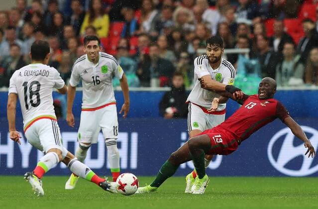 MOSCOW, RUSSIA â€“ JULY 2, 2017: Mexicoâ€™s Andres Guardado, Hector Herrera, Nestor Araujo, and Portugalâ€™s Danilo Pereira (L-R) struggle for the ball in their 2017 FIFA Confederations Cup third place football match at Otkrytie Arena. Sergei Savostyanov TASS  TS055C6C