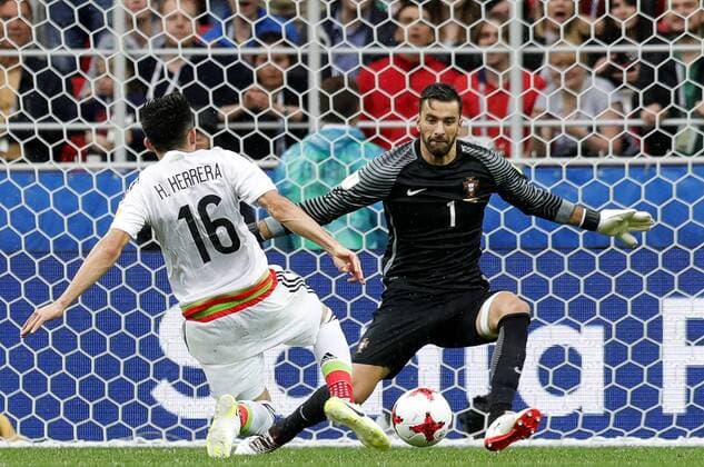 MOSCOW, RUSSIA â€“ JULY 2, 2017: Mexicoâ€™s Hector Herrera (L) attacks Portugalâ€™s goalkeeper Rui Patricio in their 2017 FIFA Confederations Cup third place football match at Otkrytie Arena. Mikhail Japaridze TASS  TS055C72