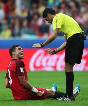 MOSCOW, RUSSIA â€“ JULY 2, 2017: Chief referee Fahal Al-Mirdasi (R) and Portugalâ€™s Pepe in their 2017 FIFA Confederations Cup third place football match against Mexico at Otkrytie Arena. Sergei Savostyanov TASS  TS055C7A