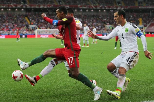 MOSCOW, RUSSIA â€“ JULY 2, 2017: Portugalâ€™s Nani and Mexicoâ€™s Rafael Marquez (L-R front) struggle for the ball in their 2017 FIFA Confederations Cup third place football match at Otkrytie Arena. Sergei Savostyanov TASS  TS055C7C