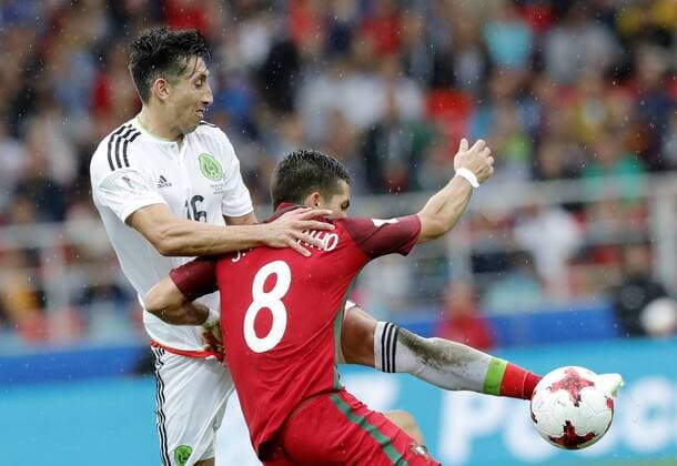 MOSCOW, RUSSIA â€“ JULY 2, 2017: Portugalâ€™s Hector Herrera (L) and Mexicoâ€™s Joao Moutinho struggle for the ball in their 2017 FIFA Confederations Cup third place football match at Otkrytie Arena. Mikhail Japaridze TASS  TS055C7E