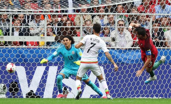 MOSCOW, RUSSIA â€“ JULY 2, 2017: Mexicoâ€™s goalkeeper Guillermo Ochoa (L back) supported by Miguel Layun (R) defends against Portugalâ€™s Pepe in their 2017 FIFA Confederations Cup third place football match at Otkrytie Arena. Sergei Savostyanov TASS  TS055C87