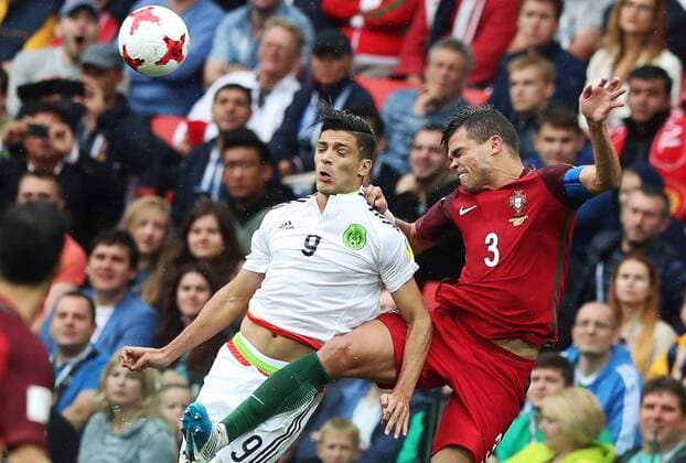 MOSCOW, RUSSIA â€“ JULY 2, 2017: Mexicoâ€™s Raul Jimenez (L) and Portugalâ€™s Pepe struggle for the ball in their 2017 FIFA Confederations Cup third place football match at Otkrytie Arena. Sergei Savostyanov TASS  TS055C8E