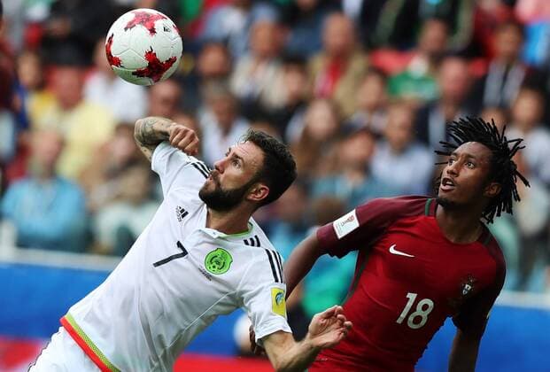 MOSCOW, RUSSIA â€“ JULY 2, 2017: Mexico s Miguel Layun (L) and Portugal s Gelson Martins fight for tha ball in their 2017 FIFA Confederations Cup third place football match at Spartak Stadium. Portugal won the game 2-1 in extra time and claimed bronze medals. Sergei Savostyanov TASS  TS055C9D