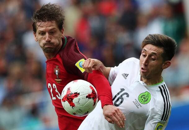 MOSCOW, RUSSIA â€“ JULY 2, 2017: Portugal s Adrien Silva (L) and Mexico s Hector Herrera fight for the ball in their 2017 FIFA Confederations Cup third place football match at Spartak Stadium. Portugal won the game 2-1 in extra time and claimed bronze medals. Sergei Savostyanov TASS  TS055CB5