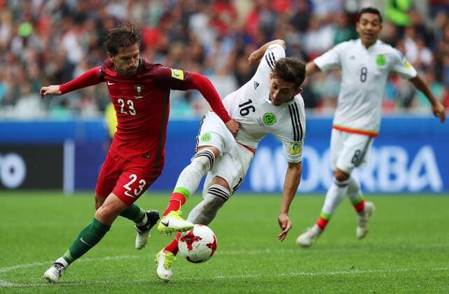 MOSCOW, RUSSIA â€“ JULY 2, 2017: Portugal s Adrien Silva (L) and Mexico s Hector Herrera fight for the ball in their 2017 FIFA Confederations Cup third place football match at Spartak Stadium. Portugal won the game 2-1 in extra time and claimed bronze medals. Sergei Savostyanov TASS  TS055CB6