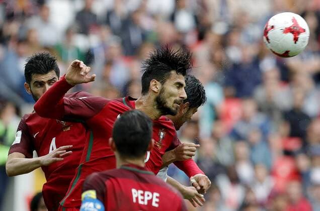 MOSCOW, RUSSIA â€“ JULY 2, 2017: Portugal s Luis Neto and Andre Gomes (L-R) jump to head the ball in their 2017 FIFA Confederations Cup third place football match against Mexico at Spartak Stadium. Portugal won the game 2-1 in extra time and claimed bronze medals. Mikhail Japaridze TASS  TS055CA7