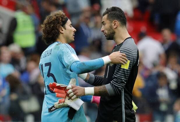 MOSCOW, RUSSIA â€“ JULY 2, 2017: Mexico s goalkeeper Guillermo Ochoa (L) and Portugal s goalkeeper Rui Patricio hug after their 2017 FIFA Confederations Cup third place football match at Spartak Stadium. Portugal won the game 2-1 in extra time and claimed bronze medals. Mikhail Japaridze TASS  TS055CA3