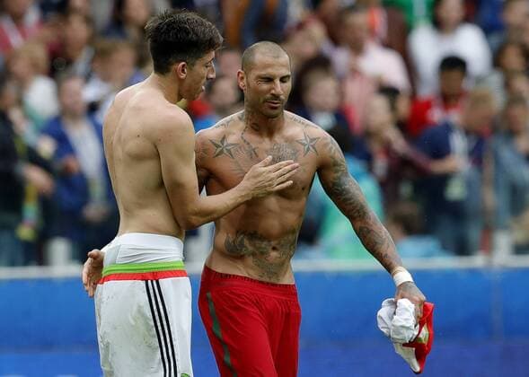 MOSCOW, RUSSIA â€“ JULY 2, 2017: Mexico s Hector Herrera (L) and Portugal s Ricardo Quaresma exchange shirts in their 2017 FIFA Confederations Cup third place football match at Spartak Stadium. Portugal won the game 2-1 in extra time and claimed bronze medals. Mikhail Japaridze TASS  TS055CA4
