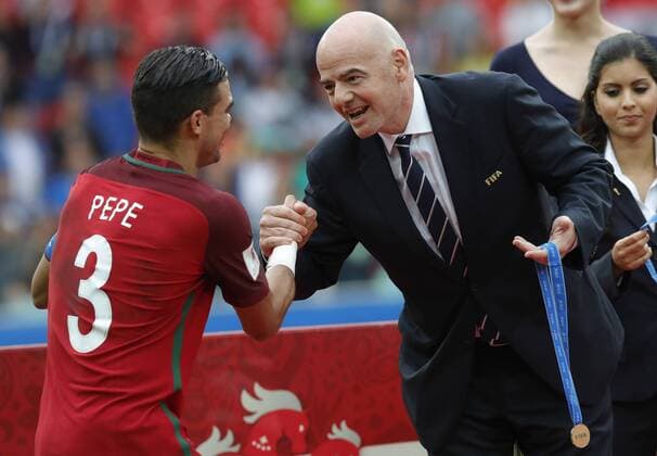 MOSCOW, RUSSIA â€“ JULY 2, 2017: Portugal s Pepe (L) shakes hands with Russia s FIFA President Gianni Infantino at an awards ceremony after winning their 2017 FIFA Confederations Cup third place football match against Mexico at Spartak Stadium. Portugal won the game 2-1 in extra time and claimed bronze medals. Mikhail Japaridze TASS  TS055CC3