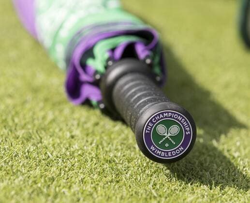 July 3rd 2017, All England Lawn Tennis and Croquet Club, London, England; The Wimbledon Tennis Championships, Day 1; A Wimbledon umbrella with The AELTC Championship Logo displayed at its base laid on the court grass xRolandxHarrisonx  ActionPlus11897334