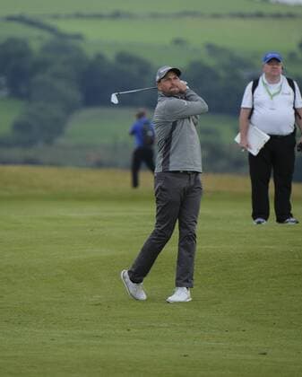 July 5th 2017, Portstewart Golf Club, Portstewart, Northern Ireland; Dubai Duty Free Irish Open Golf Championship; Pro-Am Tournament; David Howell (ENG) plays his approach shot on the 18th xNigelxCookex  ActionPlus11898092