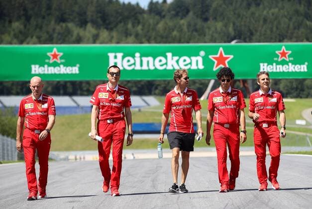 FORMULA 1 - GP of Austria 2017 SPIELBERG,AUSTRIA,06.JUL.17 - MOTORSPORTS, FORMULA 1 - Grand Prix of Austria, Red Bull Ring, preview. Image shows Sebastian Vettel (GER Ferrari) with teammembers. GEPAxpictures xChristianxWalgram