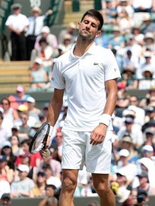 Serbian Novak Djokovic reacts during his match against Czech Adam Pavlasek on day Four of the 2017 Wimbledon championships, London on July 6, 2017.  LON2017070603 HUGOxPHILPOTT