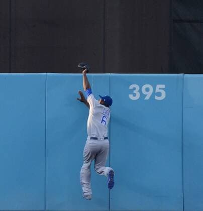 Kansas City Royals center fielder Lorenzo Cain robs Los Angeles Dodgers Chris Taylor of a home run in the first inning at Dodger Stadium in Los Angeles on July 7, 2017. The Dodgers defeated the Royals 4-1.  LAP2017070702 JIMxRUYMEN