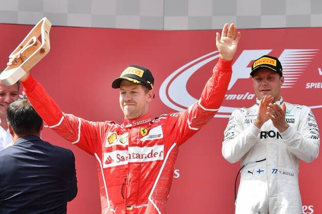 Sebastian VETTEL,GER (Scuderia Ferrari) mit seinem Pokal,Jubel,Freude,Begeisterung, Siegerehrung,re:Valtteri BOTTAS (FIN,Mercedes AMG Petronas Motorsport) Aktion, Formel 1:GP von Oesterreich, Red Bull Ring Zeltweg,Spielberg,Saison 2017,am 09.07.2017.