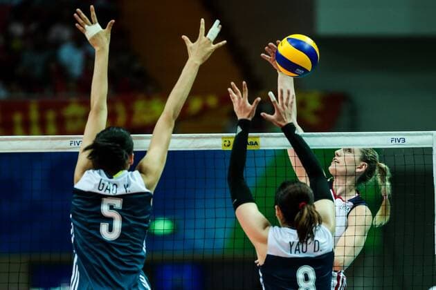 Gao Yi, left, and Yao Di of China try to block a spike against a player of the United States during the Pool B1-Group 1 match of the FIVB World Grand Prix 2017 in Kunshan city, east China s Jiangsu province, 9 July 2017. USA defeated China 3-0 after the Pool B1-Group 1 match of the FIVB World Grand Prix 2017 in Kunshan city, east China s Jiangsu province, 9 July 2017. U.S. beats China to win FIVB World Grand Prix  20170709_81665