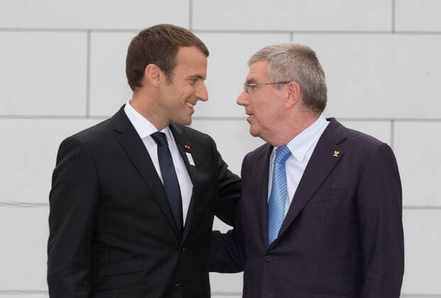 (170711) -- LAUSANNE, July 11,2017 -- French President Emmanuel Macron (L) communicates with International Olympic Committee (IOC) President Thomas Bach at the Olympic Museum in Lausanne, Switzerland, July 10, 2017. Members of IOC will hold a session for presentations by the campaign teams for Los Angeles and Paris on July 11th and 12th. ) (SP)SWITZERLAND-LAUSANNE Olympic Games Olympische Spiele Olympia OS 2024 BID XuxJinquan 