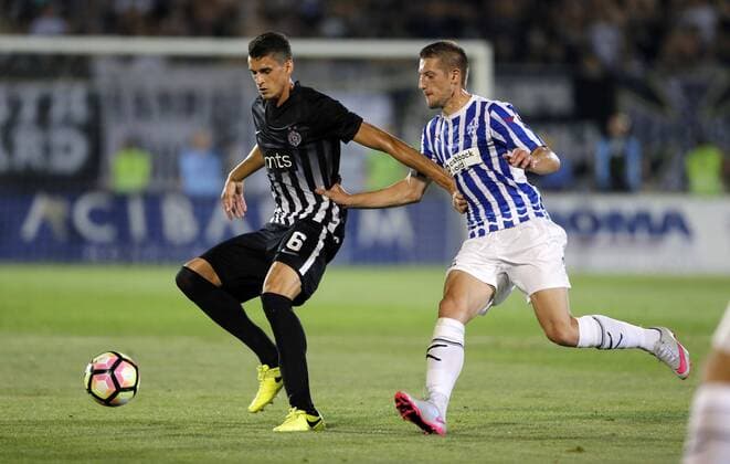 (170712) -- BELGRADE, July 12, 2017 -- Partizan s Lazar Cirkovic (L) vies with Buducnost s Miljan Vlaisavljevic during UEFA Champions League qualifying football match between Partizan and Buducnost in Belgrade, Serbia on July 11. 2017. Partizan won 2-0.) (SP)SERBIA-BELGRADE-SOCCER-UCL- QUALIFICATIONS-PARTIZAN-BUDUCNOST PredragxMilosavljevic 