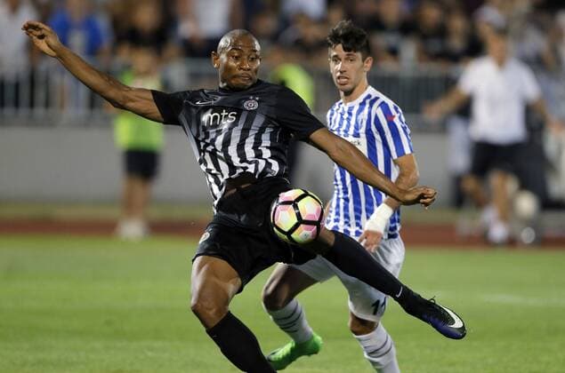 (170712) -- BELGRADE, July 12, 2017 -- Partizan s Leandre Tawamba (L) vies with Buducnost s Ilija Tucevic during UEFA Champions League qualifying football match between Partizan and Buducnost in Belgrade, Serbia on July 11. 2017. Partizan won 2-0.) (SP)SERBIA-BELGRADE-SOCCER-UCL- QUALIFICATIONS-PARTIZAN-BUDUCNOST PredragxMilosavljevic 