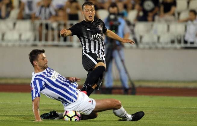 (170712) -- BELGRADE, July 12, 2017 -- Partizan s Nemanja Mihajlovic (R) vies with Buducnost s Janko Simovic during UEFA Champions League qualifying football match between Partizan and Buducnost in Belgrade, Serbia on July 11. 2017. Partizan won 2-0. ) (SP)SERBIA-BELGRADE-SOCCER-UCL- QUALIFICATIONS-PARTIZAN-BUDUCNOST PredragxMilosavljevic 