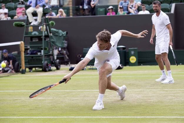 July 13th 2017, All England Lawn Tennis and Croquet Club, London, England; The Wimbledon Tennis Championships, Day 10; Wayne Ferreira (RSA) stretches to hit a backhand return during his match with Goran Ivanisevic (CRO) against Jeremy Bates (GBR) and Chris Wilkinson (GBR) xRolandxHarrisonx  ActionPlus11900780