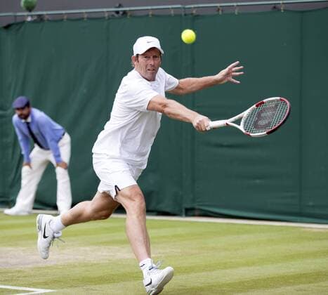 July 13th 2017, All England Lawn Tennis and Croquet Club, London, England; The Wimbledon Tennis Championships, Day 10; Jeremy Bates (GBR) hits a backhand return during his match with Chris Wilkinson (GBR) against Goran Ivanisevic (CRO) and Wayne Ferreira (RSA) xRolandxHarrisonx  ActionPlus11900801