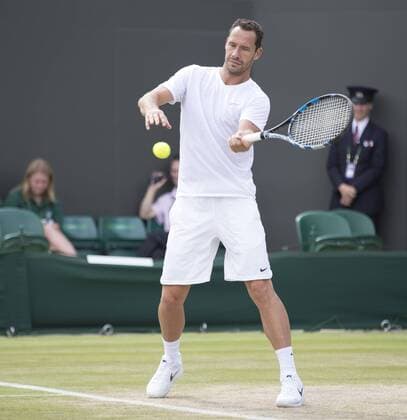 July 13th 2017, All England Lawn Tennis and Croquet Club, London, England; The Wimbledon Tennis Championships, Day 10; Michael Llordra (FRA) hits a forehand return during his match with Monsour Bahrami (IRI) against Greg Rusedski (GBR) and Fabrice Santoro (FRA) xRolandxHarrisonx  ActionPlus11900839