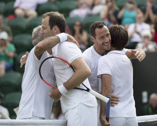 July 13th 2017, All England Lawn Tennis and Croquet Club, London, England; The Wimbledon Tennis Championships, Day 10; Michael Llordra (FRA) and Monsour Bahrami (IRI) give Greg Rusedski (GBR) and Fabrice Santoro (FRA) a hug after the match xRolandxHarrisonx  ActionPlus11900842