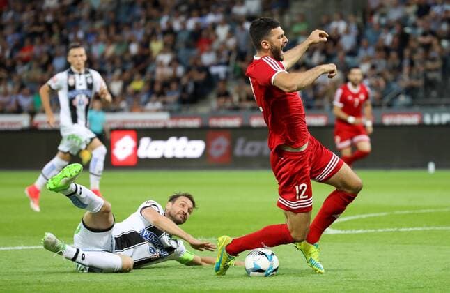 SOCCER - UEFA EL quali, Sturm vs Podgorica GRAZ,AUSTRIA,13.JUL.17 - SOCCER - UEFA Europa League qualification, SK Sturm Graz vs FK Mladost Podgorica. Image shows Christian Schulz (Sturm) and Ivan Knezevic (Podgorica). GEPAxpictures xChristianxWalgram