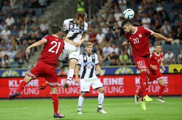 SOCCER - UEFA EL quali, Sturm vs Podgorica GRAZ,AUSTRIA,13.JUL.17 - SOCCER - UEFA Europa League qualification, SK Sturm Graz vs FK Mladost Podgorica. Image shows Nikola Vukcevic (Podgorica), Fabian Schubert, Philipp Zulechner (Sturm) and Stefan Cicmil (Podgorica). GEPAxpictures xChristianxWalgram