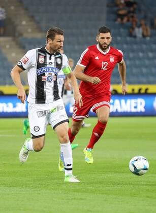 SOCCER - UEFA EL quali, Sturm vs Podgorica GRAZ,AUSTRIA,13.JUL.17 - SOCCER - UEFA Europa League qualification, SK Sturm Graz vs FK Mladost Podgorica. Image shows Christian Schulz (Sturm) and Ivan Knezevic (Podgorica). GEPAxpictures xChristianxWalgram