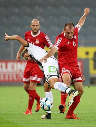 SOCCER - UEFA EL quali, Sturm vs Podgorica GRAZ,AUSTRIA,13.JUL.17 - SOCCER - UEFA Europa League qualification, SK Sturm Graz vs FK Mladost Podgorica. Image shows Thorsten Roecher (Sturm), Mirko Raicevic and Milan Durisic (Podgorica). GEPAxpictures xChristianxWalgram