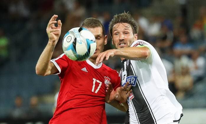 SOCCER - UEFA EL quali, Sturm vs Podgorica GRAZ,AUSTRIA,13.JUL.17 - SOCCER - UEFA Europa League qualification, SK Sturm Graz vs FK Mladost Podgorica. Image shows Zoran Petrovic (Podgorica) and Christian Schulz (Sturm). GEPAxpictures xChristianxWalgram