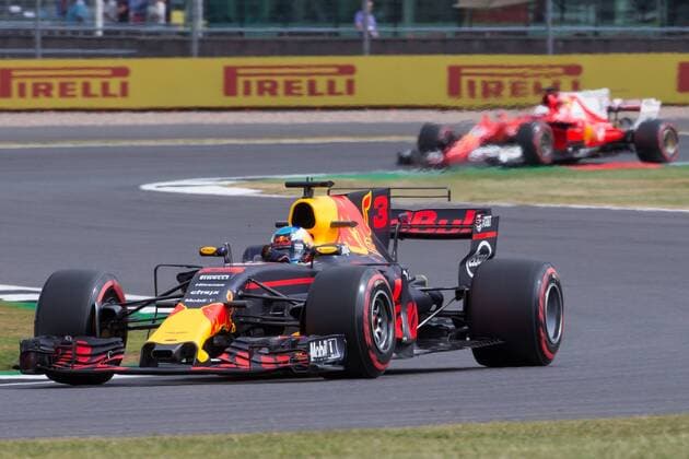 July 14th 2017, Silverstone, Northamptonshire, England; British Formula One Grand Prix, Free Practice; Red Bull Racing driver Daniel Ricciardo ahead of Scuderia Ferrari driver Kimi Raikkonen xTimxWilliamsx  ActionPlus11901111
