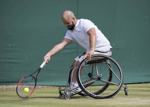 July 14th 2017, All England Lawn Tennis and Croquet Club, London, England; The Wimbledon Tennis Championships, Day 11; Stefan Olsson (SWE) hits a forehand return to Shingo Kunieda (JPN) during their match xRolandxHarrisonx  ActionPlus11901153