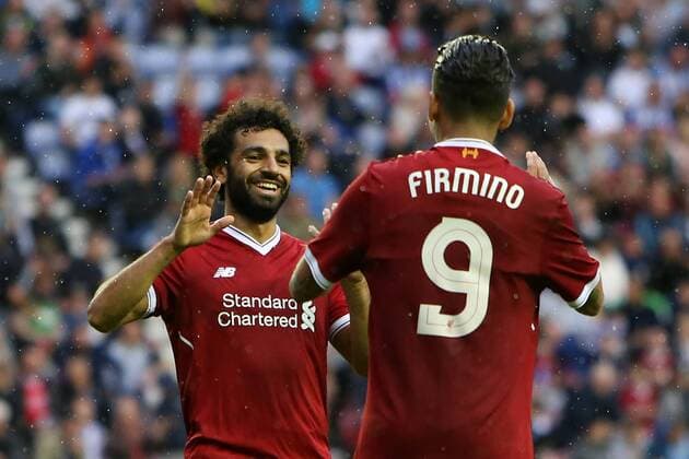 July 14th 2017, DW Stadium, Wigan, Lancashire; Pre-season football, Wigan Athletic FC versus Liverpool FC Mohammed Salah of Liverpool celebrates his debut goal with teammate Roberto Firminho xDavidxBlunsdenx  ActionPlus11901374