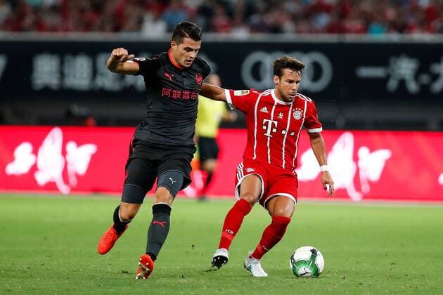 SHANGHAI, CHINA - JULY 19: Granit Xhaka 29 of Arsenal FC and Juan Bernat 14 of Bayern Muenchen vie for the ball during 2017 International Champions Cup China football match between FC Bayern Munich and Arsenal FC on July 19, 2018 in Shanghai, China.  Copyright: xVCGx CFP111120404552 