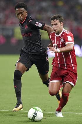 SHANGHAI, CHINA - JULY 19: Juan Bernat 14 of Bayern Muenchen and Joseph Willock 69 of Arsenal compete for the ball during 2017 International Champions Cup China between FC Bayern Munich and Arsenal FC at Shanghai Stadium on July 19, 2017 in Shanghai, China.  Copyright: xVCGx CFP111120417710 