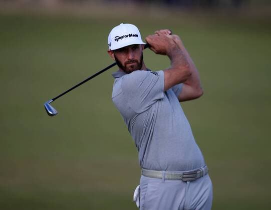 20th July 2017, Royal Birkdale Golf Club, Southport, England; The 146th Open Golf Championship, First round; Dustin Johnson (USA) intently follows the flight of his approach shot to the par five 15th hole xDavidxBlunsdenx  ActionPlus11904118