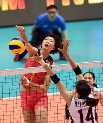 Yuan Xinyue of China spikes against Ayaka Matsumoto of Japan during the Pool G1-Group 1 match of the FIVB Volleyball World Grand Prix Hong Kong 2017 in Hong Kong, China, 21 July 2017. China defeated Japan 3-1 (25-19, 25-20, 33-35, 25-21). China defeats Japan during FIVB Volleyball World Grand Prix Hong Kong 2017  pbu656153_07