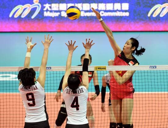 Zhu Ting, right, of China spikes against Haruyo Shimamura, and Risa Shinnabe of Japan during the Pool G1-Group 1 match of the FIVB Volleyball World Grand Prix Hong Kong 2017 in Hong Kong, China, 21 July 2017. China defeated Japan 3-1 (25-19, 25-20, 33-35, 25-21). China defeats Japan during FIVB Volleyball World Grand Prix Hong Kong 2017  pbu656153_17