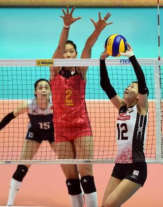 Zhu Ting of China spikes against Miya Sato of Japan during the Pool G1-Group 1 match of the FIVB Volleyball World Grand Prix Hong Kong 2017 in Hong Kong, China, 21 July 2017. China defeated Japan 3-1 (25-19, 25-20, 33-35, 25-21). China defeats Japan during FIVB Volleyball World Grand Prix Hong Kong 2017  pbu656153_18