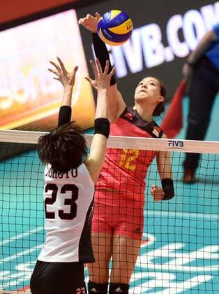 Zheng Yixin of China spikes against Rika Nomoto of Japan during the Pool G1-Group 1 match of the FIVB Volleyball World Grand Prix Hong Kong 2017 in Hong Kong, China, 21 July 2017. China defeated Japan 3-1 (25-19, 25-20, 33-35, 25-21). China defeats Japan during FIVB Volleyball World Grand Prix Hong Kong 2017  pbu656153_20