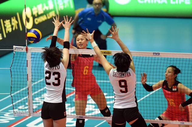 Gong Xiangyu, left, of China spikes against Rika Nomoto, and Haruyo Shimamura of Japan during the Pool G1-Group 1 match of the FIVB Volleyball World Grand Prix Hong Kong 2017 in Hong Kong, China, 21 July 2017. China defeated Japan 3-1 (25-19, 25-20, 33-35, 25-21). China defeats Japan during FIVB Volleyball World Grand Prix Hong Kong 2017  pbu656153_19