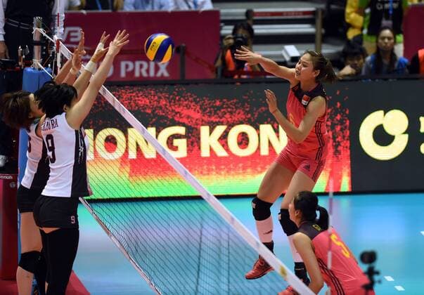 Xiangyu Gong, right, of China spikes against Haruyo Shimamura of Japan during the Pool G1-Group 1 match of the FIVB Volleyball World Grand Prix Hong Kong 2017 in Hong Kong, China, 21 July 2017. China defeated Japan 3-1 (25-19, 25-20, 33-35, 25-21). China defeats Japan during FIVB Volleyball World Grand Prix Hong Kong 2017  pbu656153_22