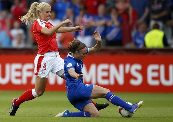 (170723) -- DOETINCHEM, July 23, 2017 -- Rachel Rinast (L) of Switzerland vies with Sif Atladottir of Iceland during the UEFA Women s EURO 2017 soccer tournament Group C match between Switzerland and Iceland at the Vijverberg Stadium in Doetinchem, the Netherlands, on July 22, 2017. Switzerland won 2-1. ) (wll) (SP)THE NETHERLANDS-DOETINCHEM-SOCCER-UEFA-WOMEN S EURO-SUI VS ISL YexPingfan 